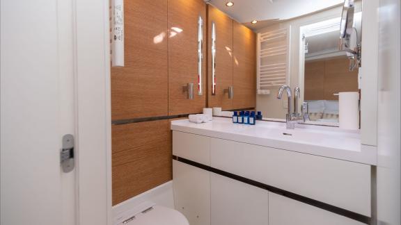 Among sailing yacht rental options in Kastela Bubbles bathroom with sink and storage offers a clean and functional onboa