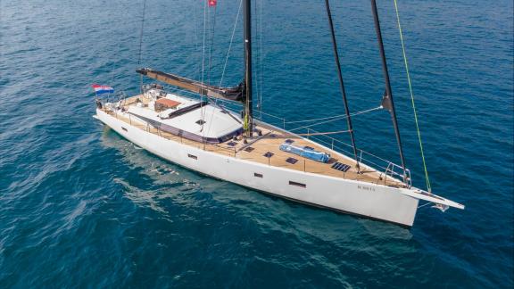 Among sailing yacht rental options in Kastela Bubbles is seen cruising showing its exterior hull and deck structure.