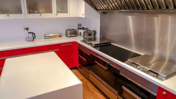 The modern kitchen on Code 8 yacht elevates your Dubai yacht rental experience to a luxurious level.