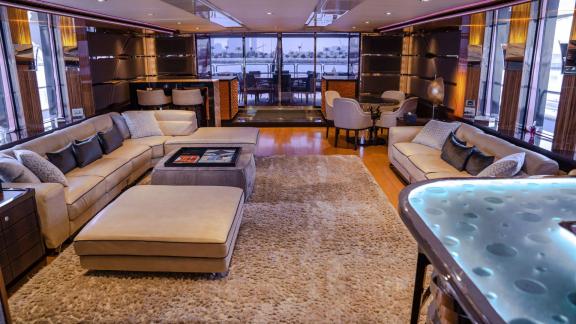 Enjoy Dubai luxury yacht rental in the spacious and elegant lounge of the Code 8 yacht.