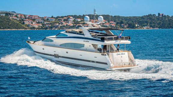 Horizon Elegance 90 Conte Alberti is seen cruising near Split, showcasing its aft deck and elegant profile.
