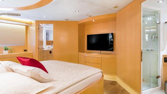 Horizon Elegance 90 Conte Alberti features a comfortable master cabin with a TV unit and private bathroom access.