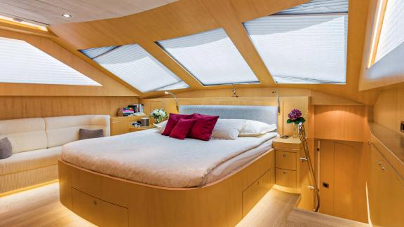 Horizon Elegance 90 Conte Alberti features a bright master cabin with a spacious double bed and overhead skylights.