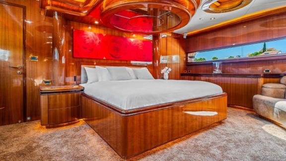 Horizon Elegance 115 Conte Stefani features a spacious master suite with a double bed and elegant wood décor.