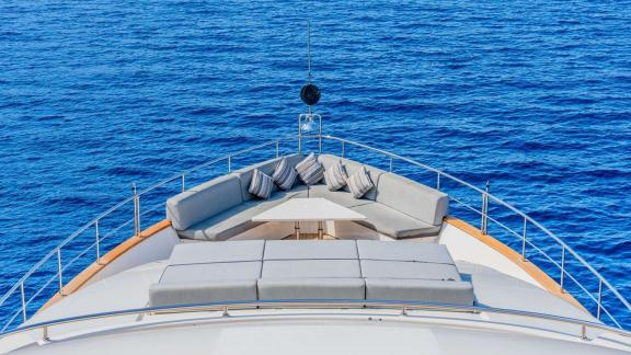 Crn 128 Ariela’s front deck offers cushioned seating and sunbeds for relaxation in Göcek waters.