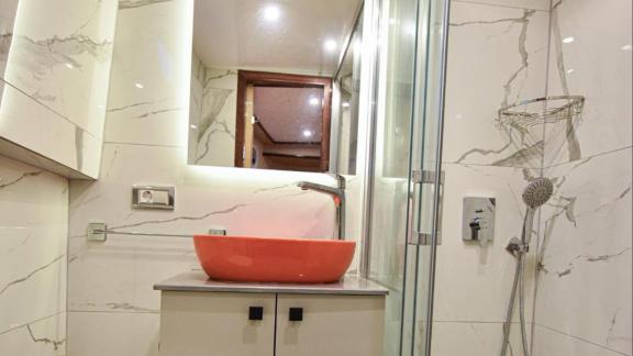 Among motor yacht rental options in Gocek Dalibay 2 bathroom shows sink shower cabin and bright interior onboard.