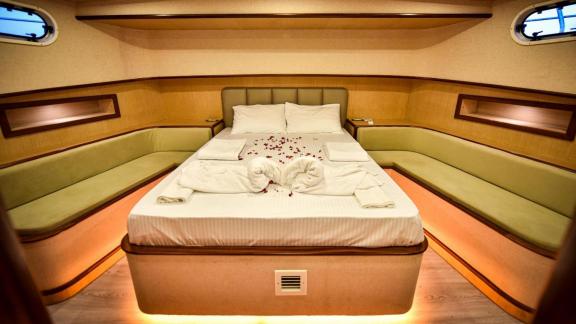 Among motor yacht rental options in Gocek Dalibay 2 cabin shows front view double bed and side seating areas.