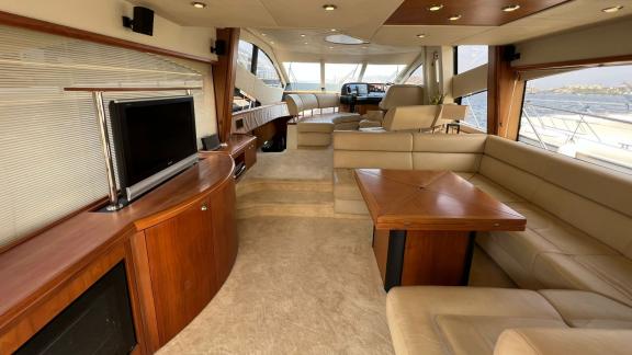 The spacious salon of the Distraction motor yacht features comfortable seating and modern amenities.