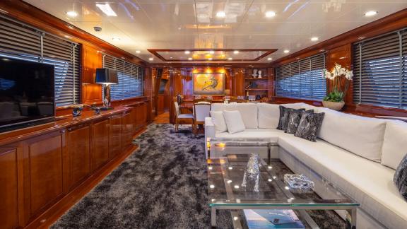 Spacious salon on Divine yacht with comfortable seating and elegant decor.