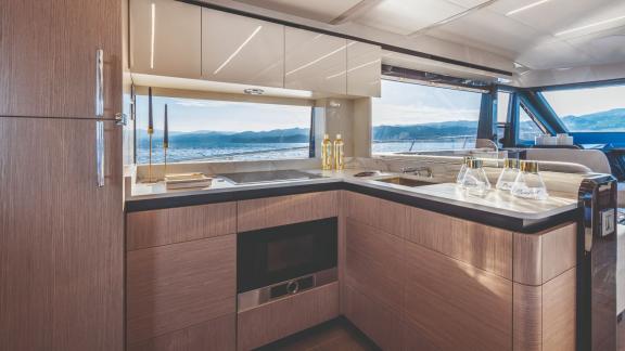 The modern kitchen of Emilia 2 is spacious, equipped with elegant wooden details.