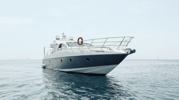 The motor yacht Esperanza cruises peacefully on the open sea, showcasing its modern design.