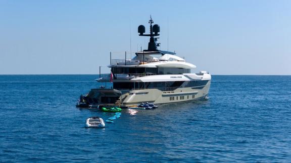 Eternal Spark motor yacht is anchored off Monaco with jet skis and sea toys for private yacht charter.