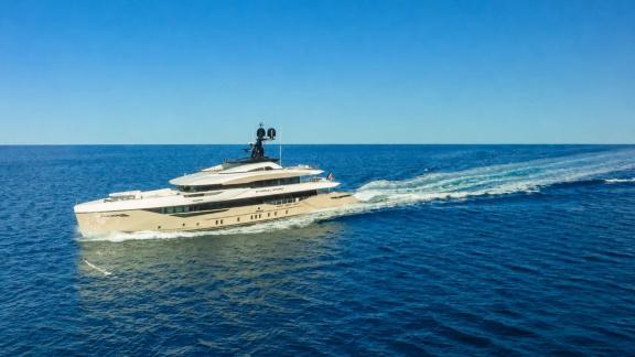 Eternal Spark motor yacht sails across open waters during a luxury yacht charter journey near Monaco coast.