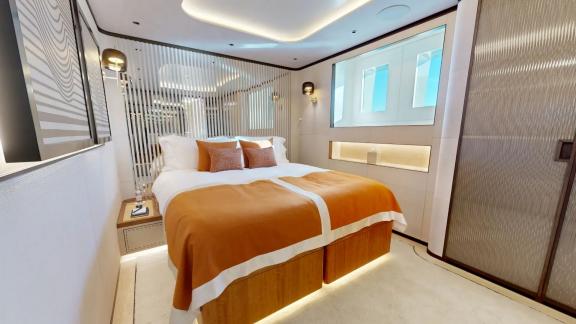 The guest cabin on Eternal Spark offers modern comfort and refined interiors during luxury yacht charter holidays.