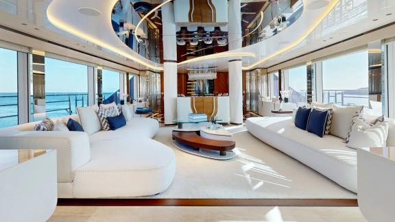 The main salon on Eternal Spark features elegant interiors and panoramic sea views for luxury yacht charter guests.