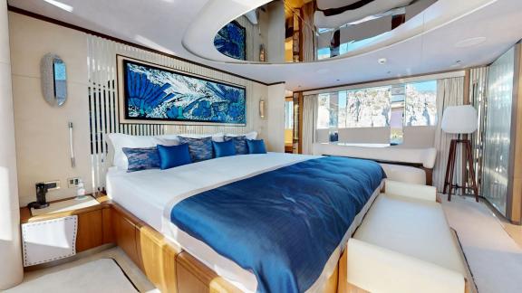 The master cabin on Eternal Spark features elegant interiors and sea views for an exclusive yacht charter stay.