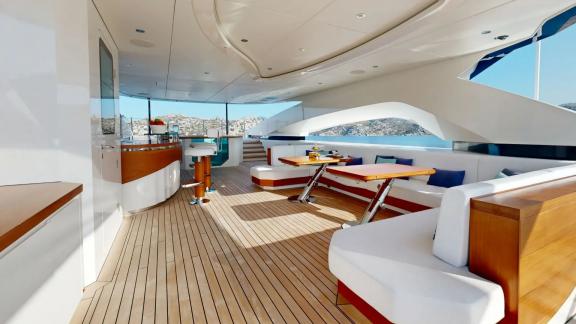 The dining area on Eternal Spark offers panoramic sea views and elegant comfort during private yacht charter trips.