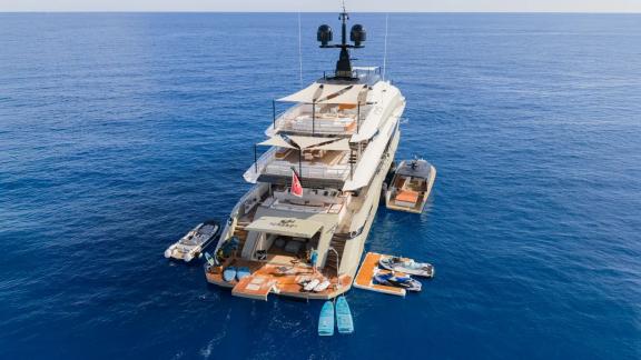 Eternal Spark motor yacht is anchored near Monaco with water toys and tender boats for luxury yacht charter.