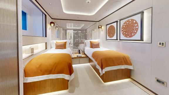 The twin guest cabin on Eternal Spark offers modern comfort and elegant accommodation during yacht charter holidays.