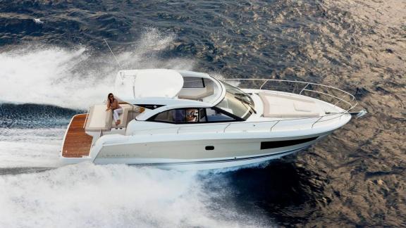 Among Nice luxury yacht charter options, Exocet is seen cruising at high speed on open waters.
