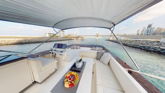 The flybridge area of the Ferretti 670 motor yacht elevates your hourly yacht rental experience in Dubai with elegance a