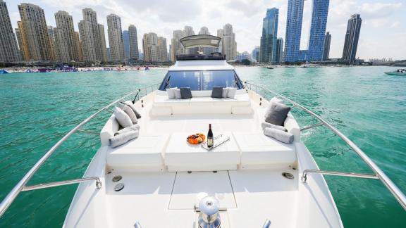 The bow deck of the Ferretti 670 motor yacht adds elegance and comfort to your luxurious yacht rental in Dubai.