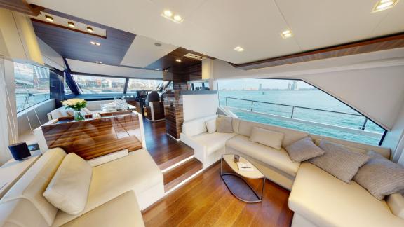 The spacious interior of the Ferretti 670 motor yacht adds elegance to your luxurious yacht rental experience in Dubai.