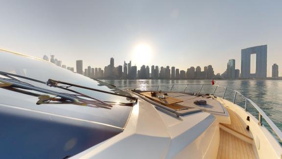 The Ferretti 780 motor yacht offers a luxurious touch to your Dubai yacht rental with an unforgettable sunset view.