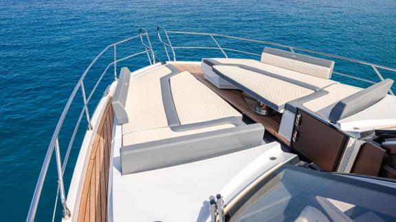 The deck of the FG Star yacht features spacious and comfortable lounging cushions.