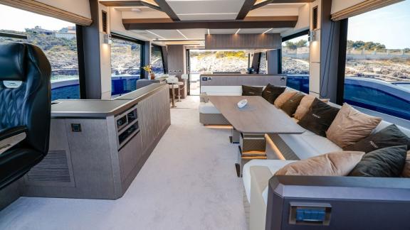 The FG Star yacht features a comfortable seating area and a fully equipped kitchen.