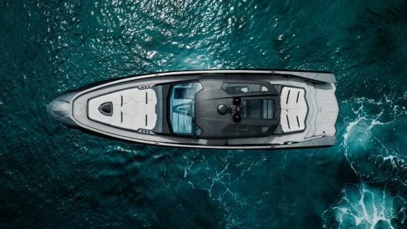 Top view of the Figo motor yacht showcasing its luxurious design and spacious decks while cruising.