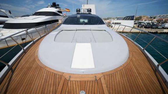 The wooden bow deck of motor yacht Five Stars is seen docked in the marina.