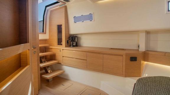 Among Saint Tropez yacht charter options Fortitude motor yacht shows galley cabinets and stair access.