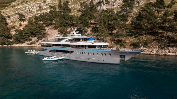 Relax on the 48m MY Freedom with 11 cabins in an idyllic bay.