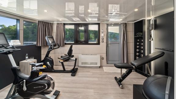 Modern gym on the 48m MY Freedom with 11 cabins.