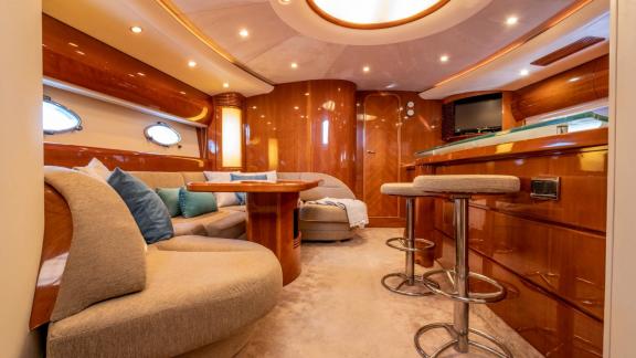 An Ibiza, Spain yacht charter lets you enjoy relaxing moments in the stylish and elegant interior salon of the Freedom.