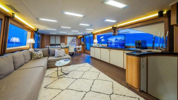 Monte Carlo 86 Giorgio features a large, elegant saloon with cozy seating and refined decor.