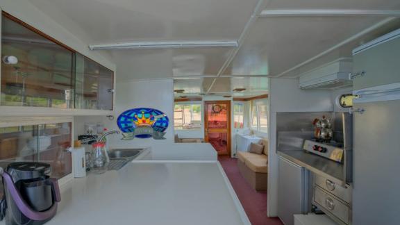 The kitchen on the trawler Grainne Mhaol is fully equipped and stylishly designed for comfortable meal preparation.