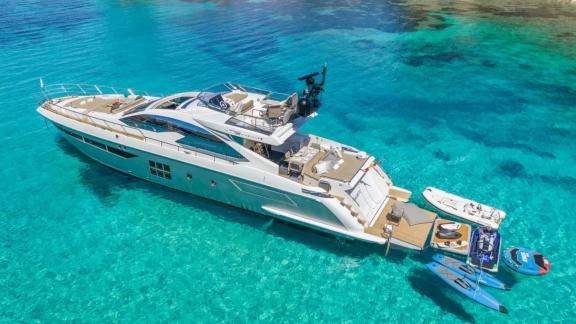 Among Mallorca yacht charter options Gran Abe II shows aft platform and water sports gear.