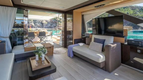 Among Mallorca yacht charter options Gran Abe II shows salon with seating and sea view.