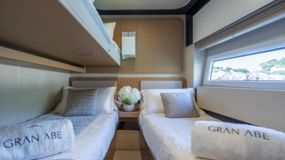 Among Mallorca yacht charter options Gran Abe II shows cabin with two separate beds.