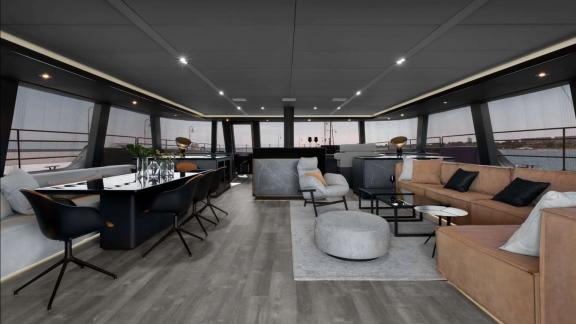 Modern salon on Sunreef Catamaran with elegant decor, dining table, and lounge area.