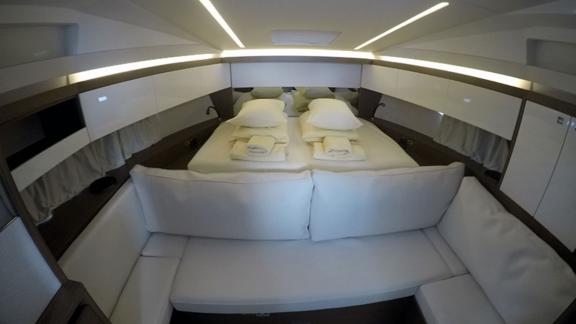 The comfortable bedroom of motor yacht Il Sogno features a stylish and spacious design.