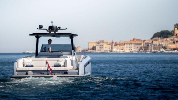Among Saint Tropez boat tour options, Je Men Fous is seen cruising along the coastline.