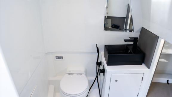 Among Saint Tropez boat rental options, Je Men Fous is seen with a modern bathroom area.