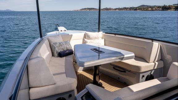 Among Saint Tropez day boat rental options, Je Men Fous is seen with an outdoor dining area on the foredeck.