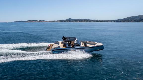 Among Saint Tropez private boat tour options, Je Men Fous is seen cruising at high speed.