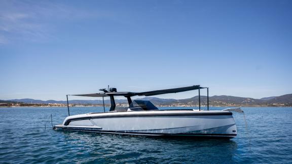 Among Saint Tropez day boat rental options, Je Men Fous is seen anchored in a calm bay.