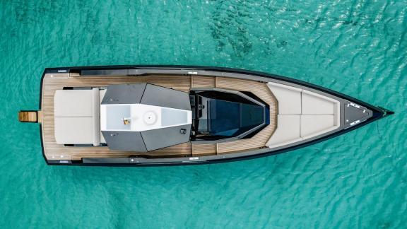 Aerial view of Jemima motor yacht with a perfect deck layout against the backdrop of turquoise waters.