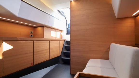 The modern interior design of Jemima motor yacht features a comfortable seating area and sleek, minimalist lines.